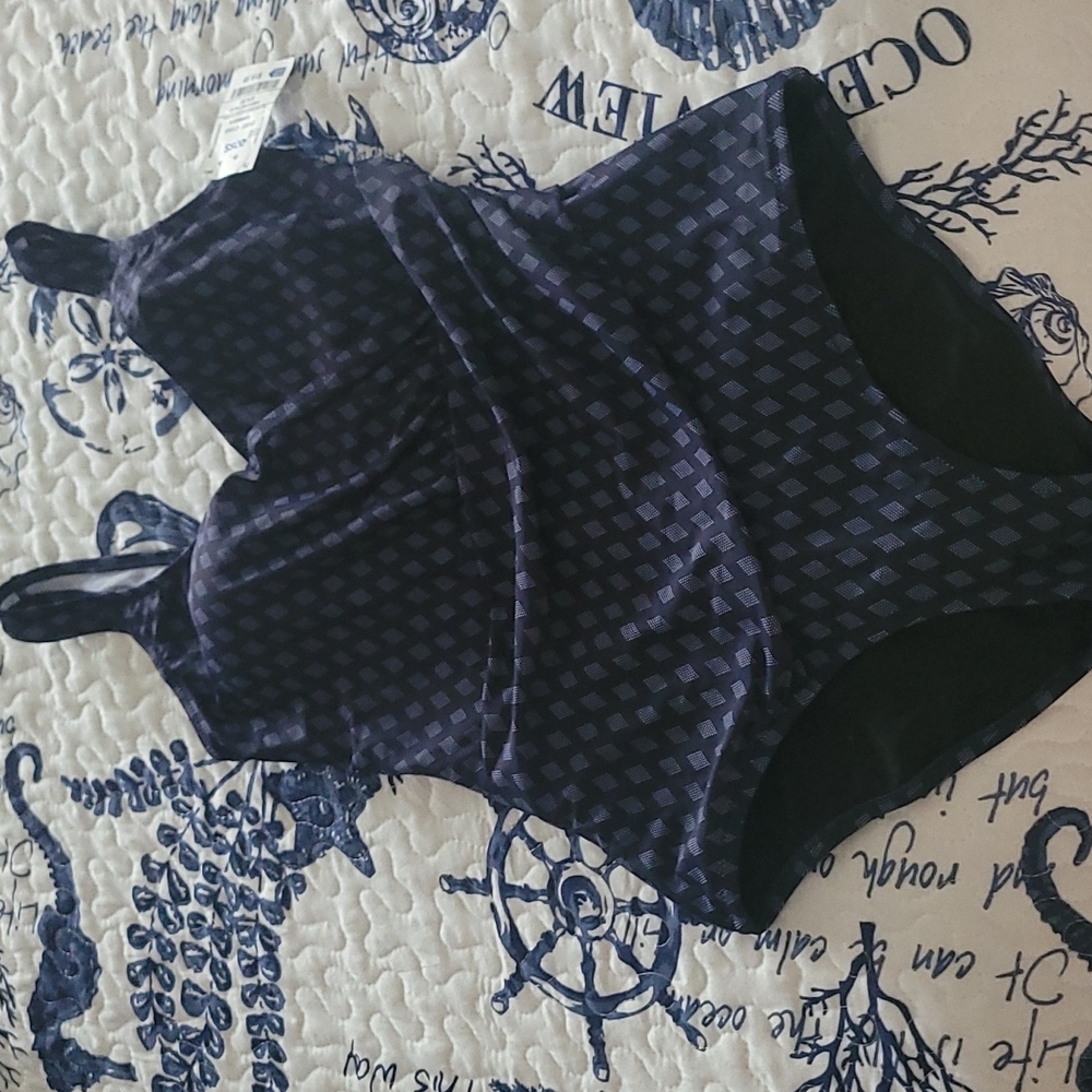 Navy one piece swim suit. Size medium. Never worn.